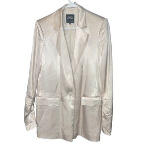 A set of jacket and pants in a shiny pearl color.  Nice fabric